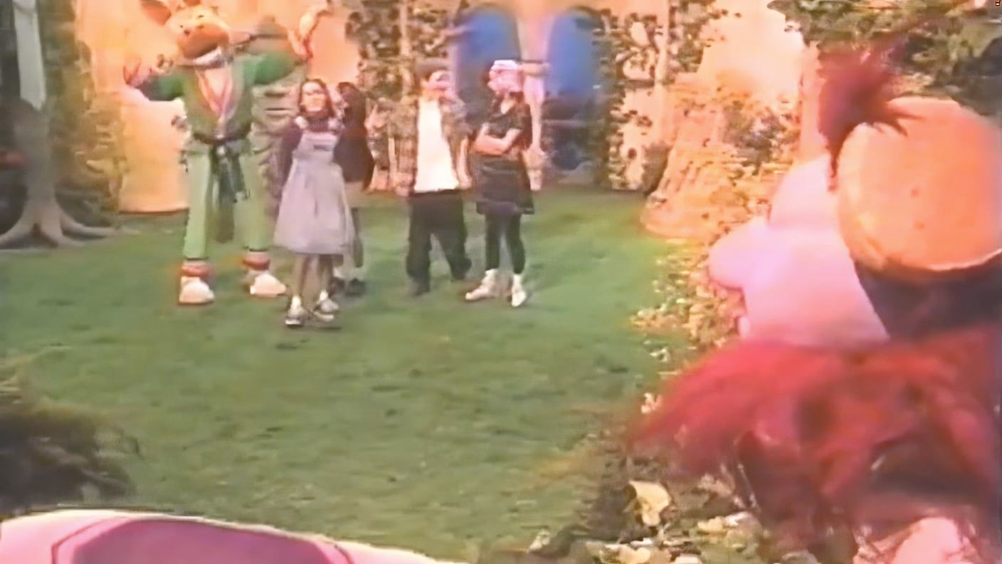 KangaRoddy and the young cast mid number on the garden set, Bantu in the foreground