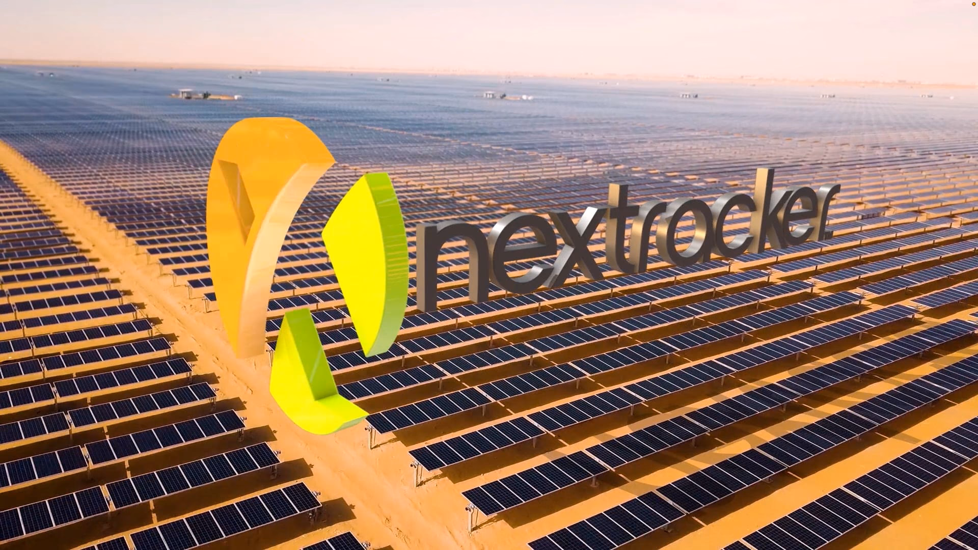 The NX logo as a 3‑D extrusion flying in over a desert solar array
